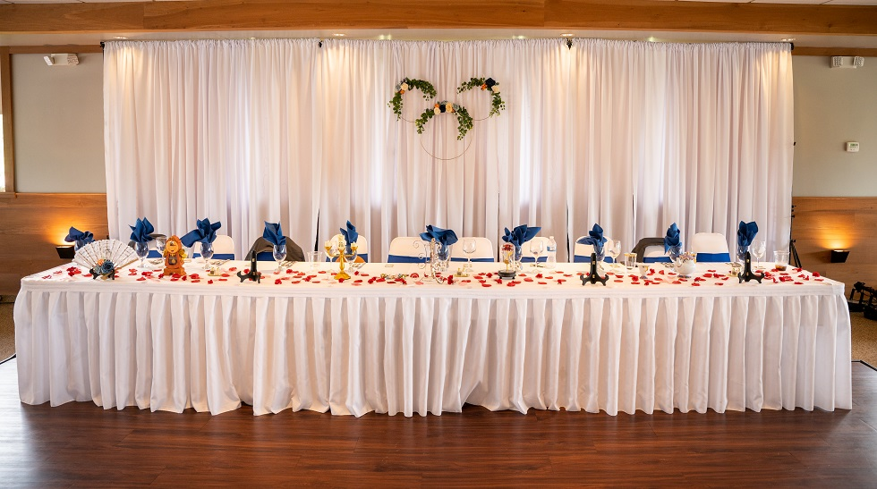 Pipe And Drape in white at a wedding reception